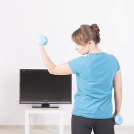 person working out at home with weights