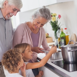 children cooking with grandparents