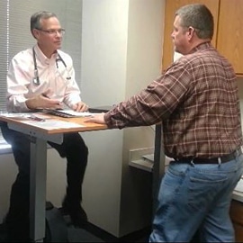 dr lazarus in moving room with a patient