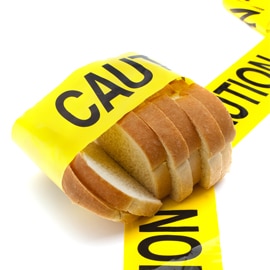 caution tape around loaf of bread
