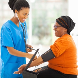 doctor checking blood pressure of a heavy patient