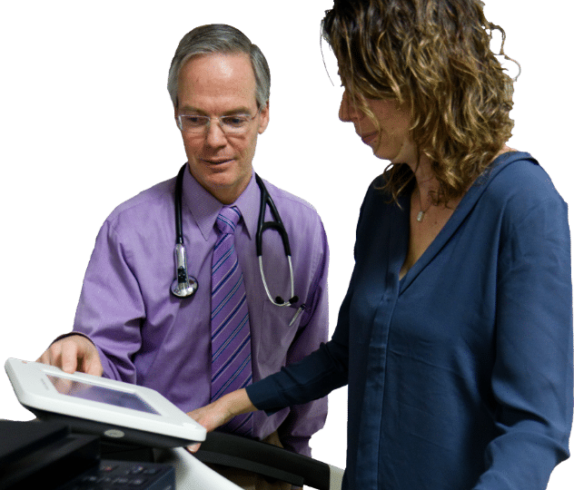 Dr Lazarus doing a body composition test on a patient