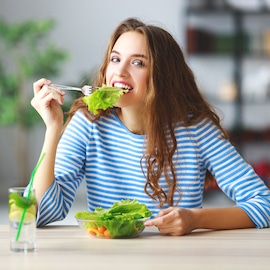 person eating a salad